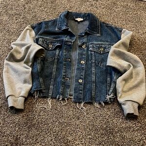 A. Peach cut off jean jacket with gray sweatshirt material sleeves size small